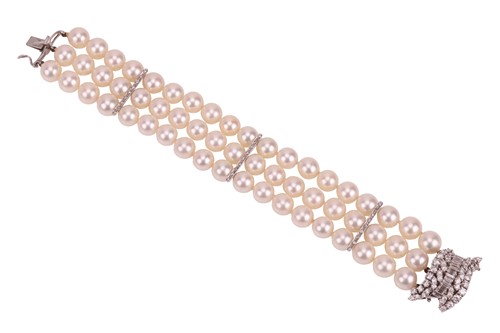 Lot 79 - A cultured pearl bracelet with diamond-set...