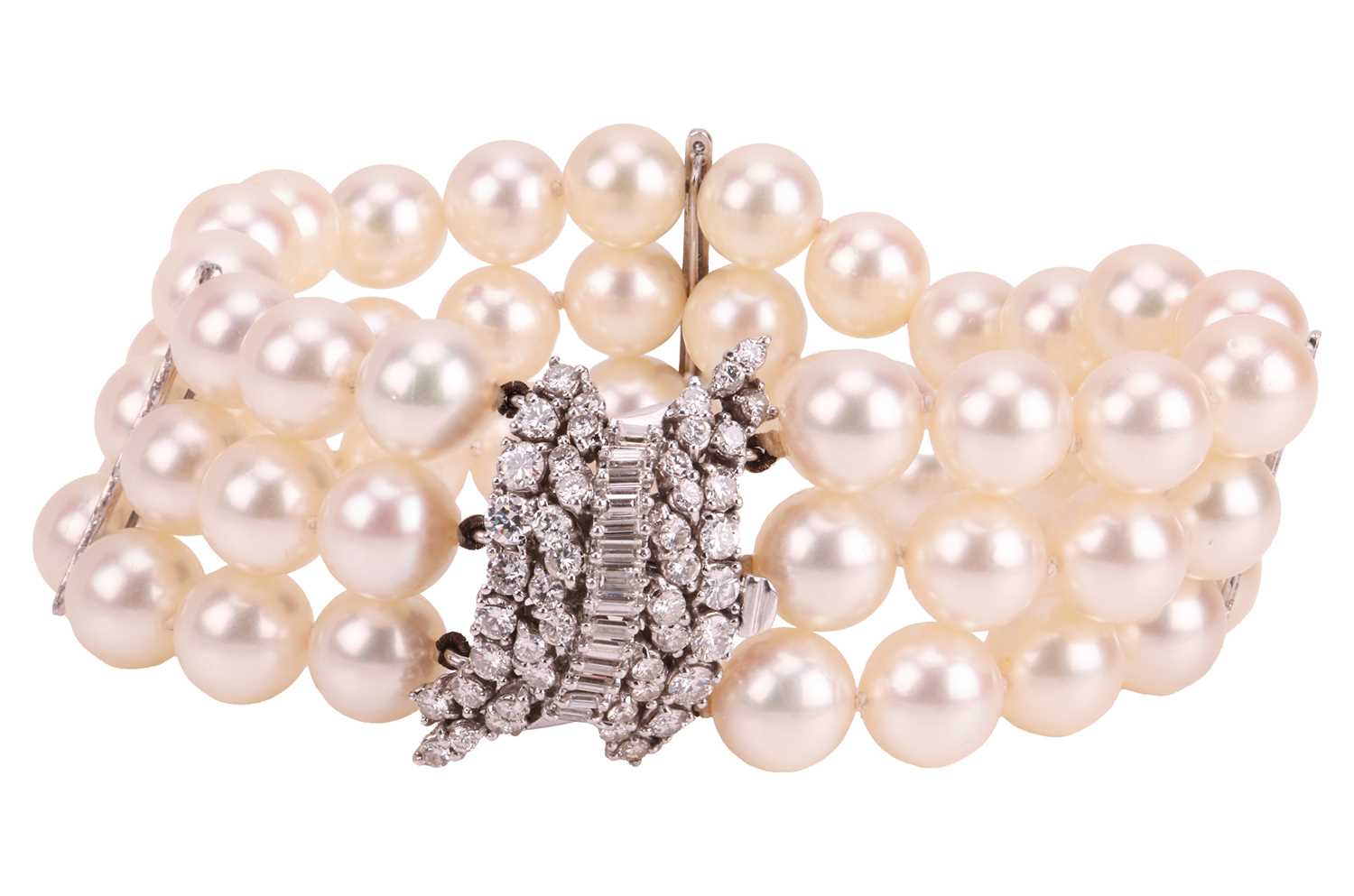 Lot 79 - A cultured pearl bracelet with diamond-set...