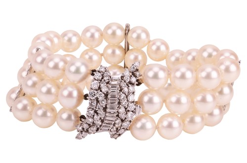 Lot 79 - A cultured pearl bracelet with diamond-set...