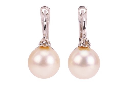 Lot A pair of cultured pearl earrings, each...