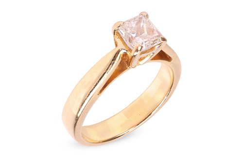 Lot 216 - A diamond solitaire ring, featuring a central...