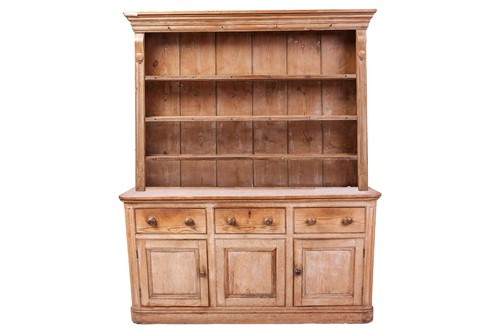 Lot 37 - A Victorian waxed pine dresser, the shelved...