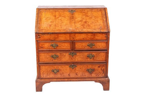 Lot A George III figured walnut bureau, the drop...