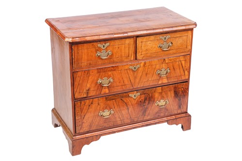 Lot 55 - A George II style crossbanded walnut chest of...