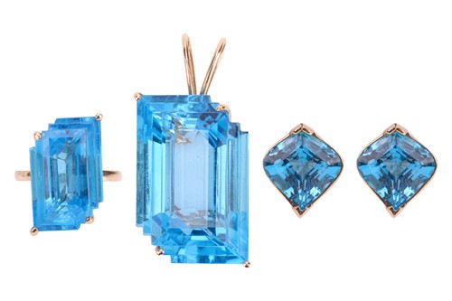 Lot A large topaz pendant, a cocktail ring and a...