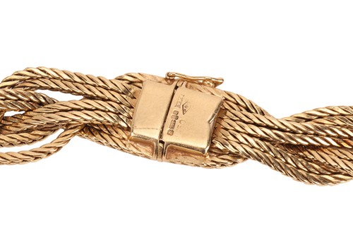 Lot A braided collar necklace in 18ct yellow gold,...