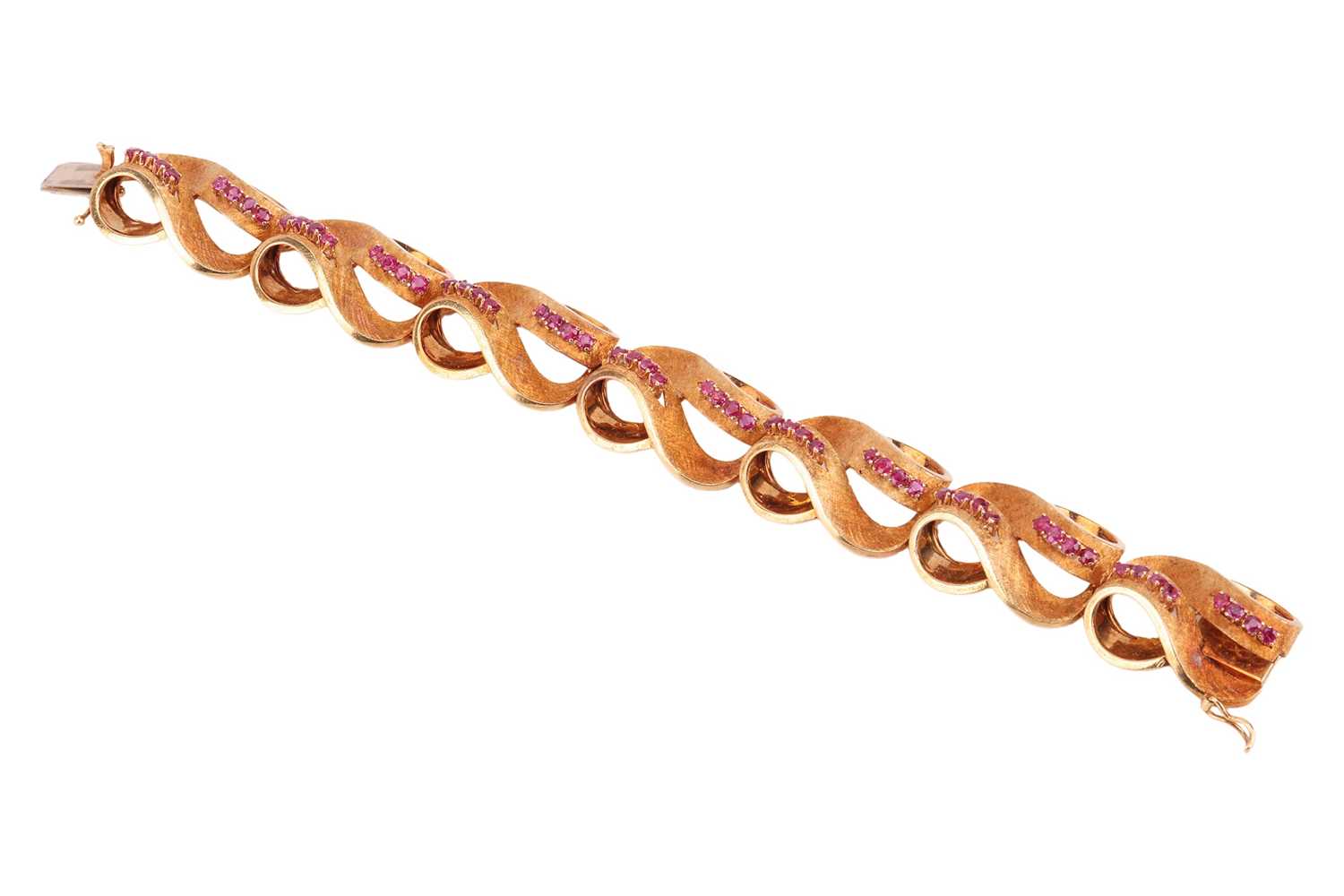 Lot An Italian ruby-set lemniscate link bracelet,...