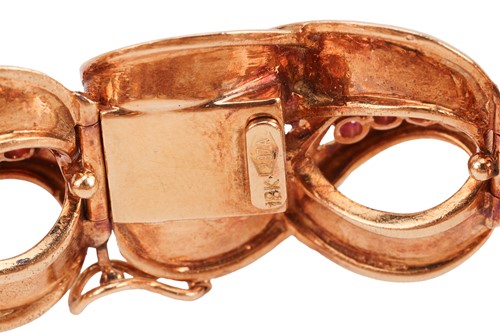 Lot An Italian ruby-set lemniscate link bracelet,...