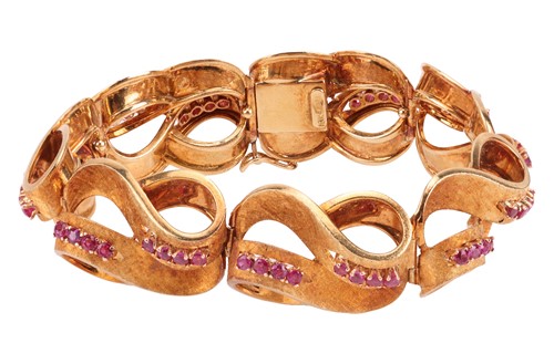 Lot An Italian ruby-set lemniscate link bracelet,...