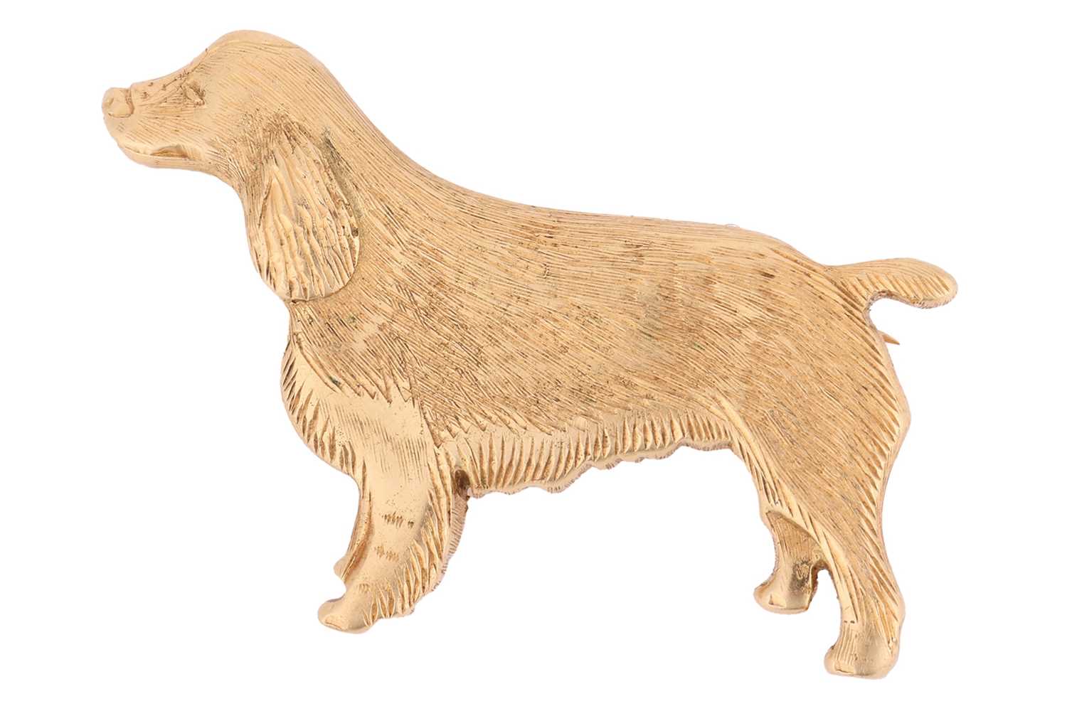 Lot A dog brooch in 18ct yellow gold, sculpted as...