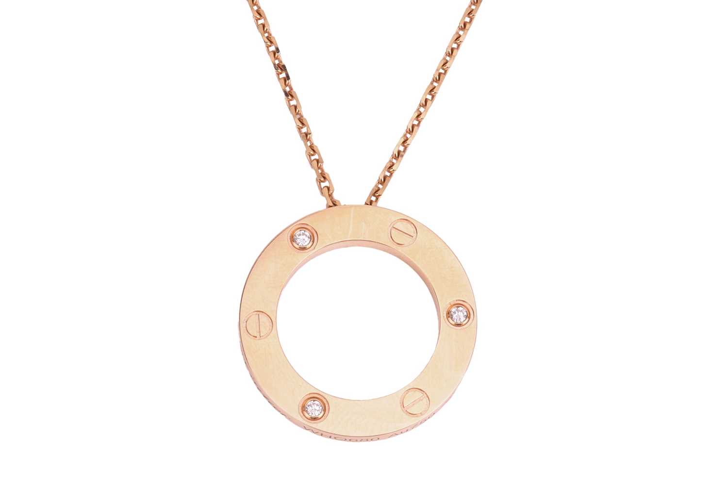 Lot 309 - Cartier - a 'Love' pendant on chain, set with...