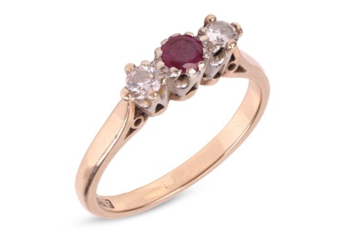 Lot 15 - A three-stone half hoop ruby and diamond ring,...