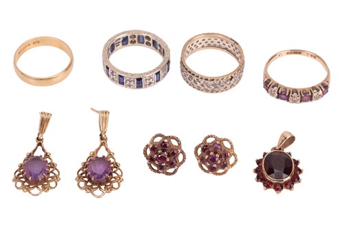 Lot 37 - An 18 carat gold wedding band (2.2 grams),...