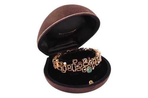 Lot A Modernist multi-gem bangle, designed by Karl...