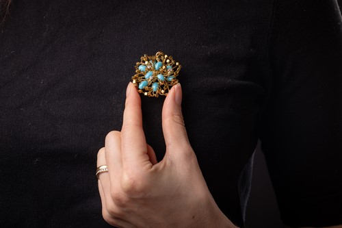 Lot A turquoise and diamond brooch, of an abstract...