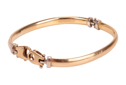 Lot A two-toned hinged bracelet, composed of two...