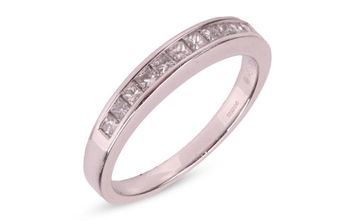 Lot 156 - A half hoop diamond eternity ring, channel set...