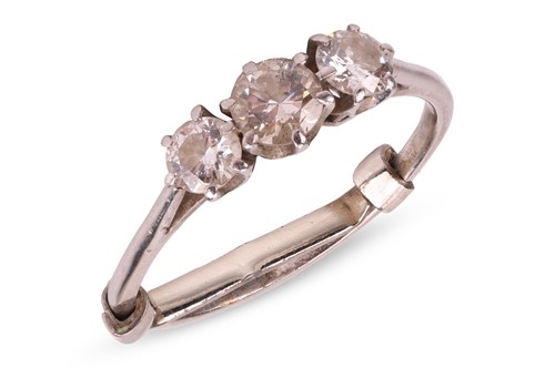 Lot 147 - A diamond three stone half hoop ring; the...