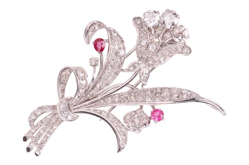 Lot A floral spray brooch set with diamond and...