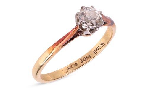 Lot 182 - A diamond solitaire ring, claw-set with an old-...