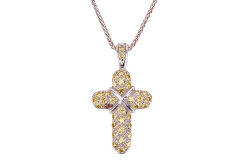 Lot 92 - A yellow diamond set cross pendant; the...