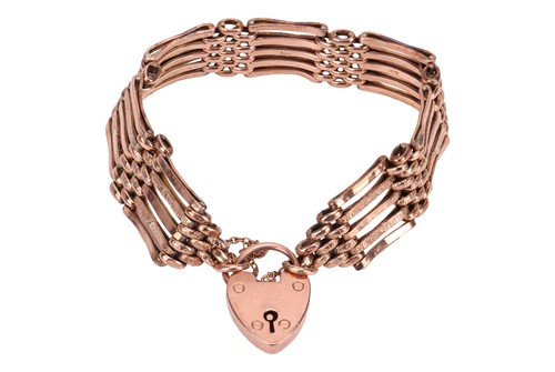 Lot 37 - A gate link bracelet with heart lock clasp,...