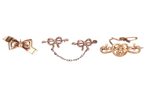 Lot 34 - Three brooches; to include a Stafford knot bar...