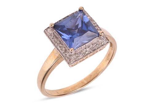 Lot 235 - A synthetic sapphire dress ring in 9ct gold,...