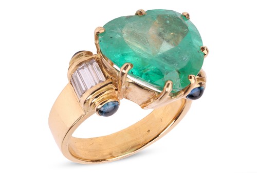 Lot 204 - A large heart-shaped emerald dress ring, the...