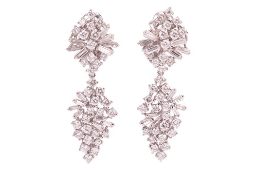Lot 222 - A pair of diamond pendant earrings, comprising...