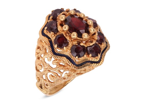 Lot A garnet cluster ring, comprises an oval...