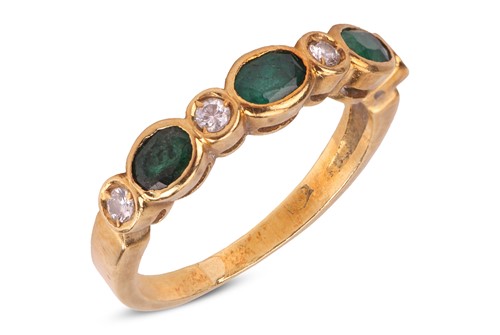 Lot An emerald and diamond half-hoop ring,...