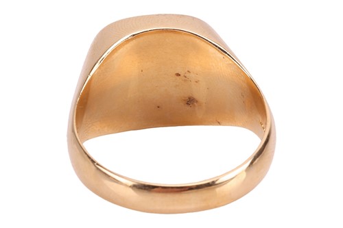 Lot 292 - A textured signet ring in 18ct gold, the...
