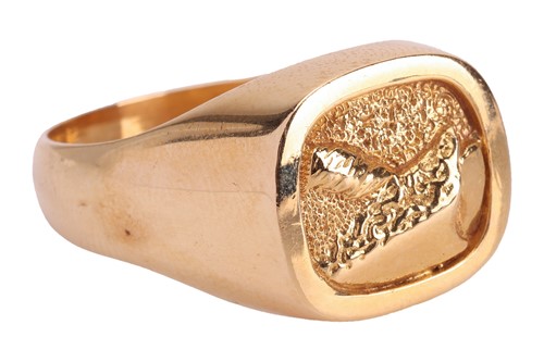 Lot 292 - A textured signet ring in 18ct gold, the...