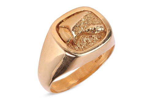 Lot 292 - A textured signet ring in 18ct gold, the...
