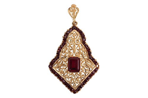 Lot A gem-set arabesque pendant, consisting of an...
