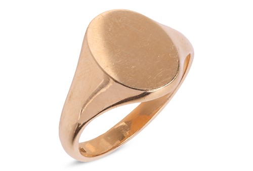 Lot 115 - A signet ring, the vacant oval head leading to...