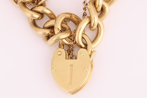 Lot 207 - A charm bracelet, comprising a heavy curb link...