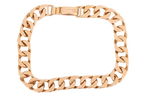 Lot 14 - A flat curb link bracelet in 18ct yellow gold,...