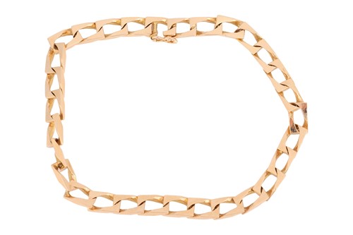 Lot 30 - A flat angular curb link bracelet, the links...