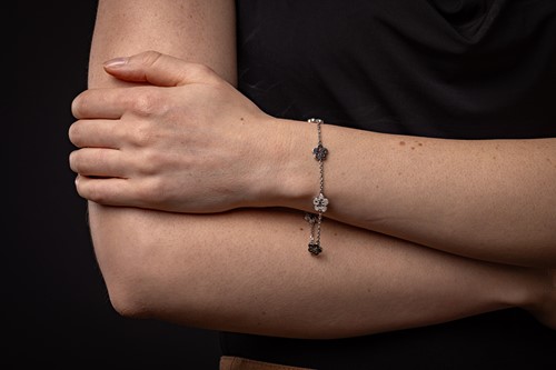 Lot Boodles - A diamond-set 'Blossom' charm...