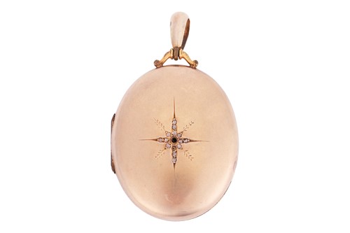 Lot 6 - A gilt diamond-set locket, the oval cover...