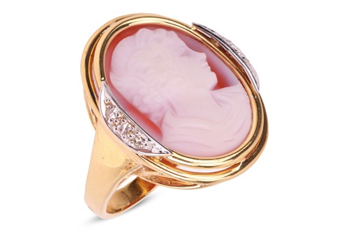 Lot 131 - A cameo dress ring, the oval agate carved with...
