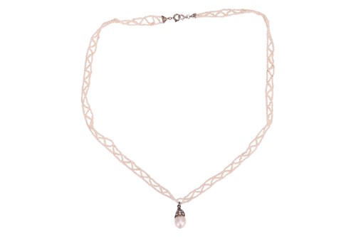 Lot 11 - An Edwardian natural saltwater pearl drop...
