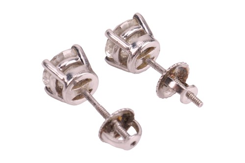 Lot 235 - Tiffany & Co. - a pair of single stone diamond...