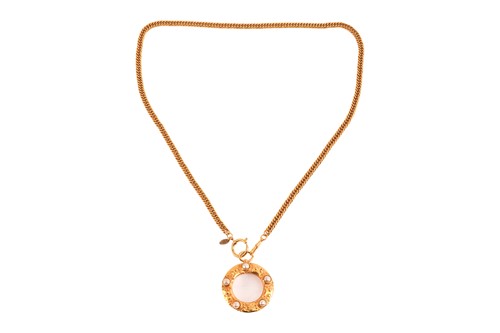 Lot 248 - Chanel - a magnifying glass pendant on chain,...