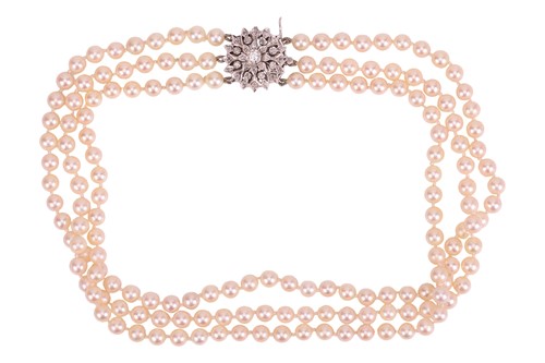 Lot 180 - A three-row cultured Akoya pearl necklace with...