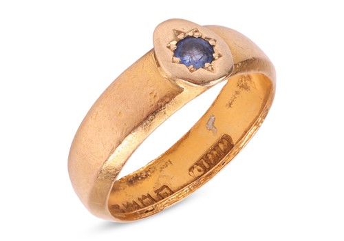 Lot 34 - A sapphire-set gypsy ring, with oval setting,...