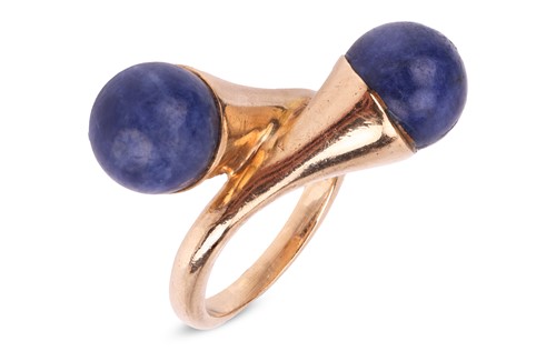 Lot 67 - A lapis lazuli cross-over ring in 9ct yellow...