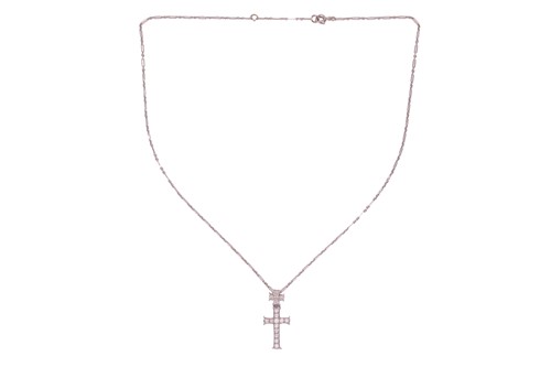 Lot 227 - Dior - a diamond-set double cross pendant on...